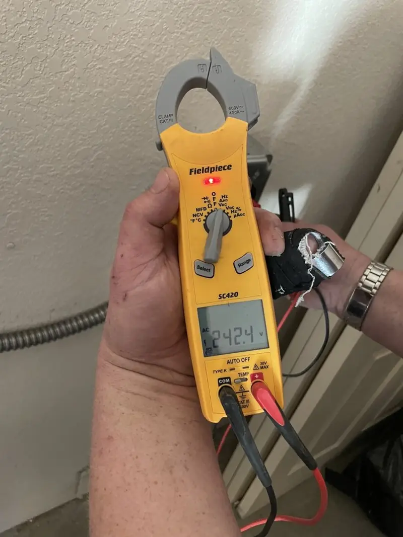 Voltage testing with clamp meter during Ceiling Fan Installation in Mount Vernon